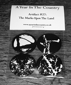 Artifact-27-250-The-Marks-On-The-Land-badge-set-front-of-badge-set-A-Year-In-The-Country-copy-1