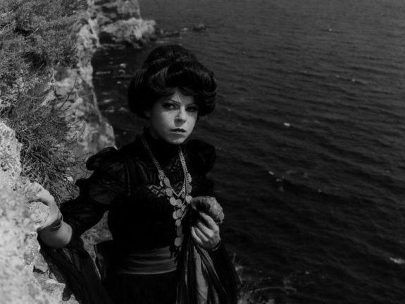 morgiana-1972-001-woman-on-rocks-above-sea